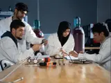 A group of students conducting an experiment.