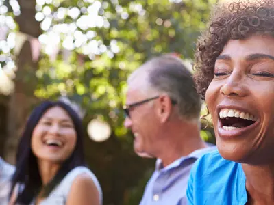 Group of people laughing and smiling