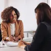 Two individuals meeting in an office