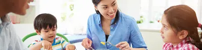 Family enjoying food at the dinner table