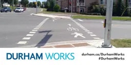 Image shows a mixed crossride. An icon of a person walking and a bike are also painted on the road. Text under image states: “Durham Works, durham.ca/DurhamWorks #DurhamWorks.”