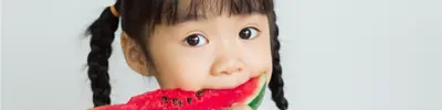 Child eating a watermelon