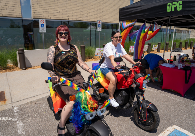 Patrons pose on bikes.