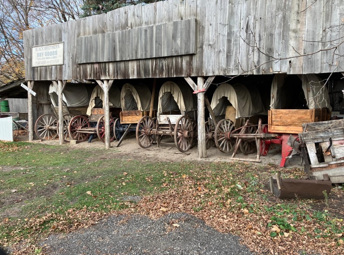 Old structure storing western-style wagons.