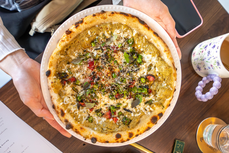 Overhead shot of an upscale pizza.