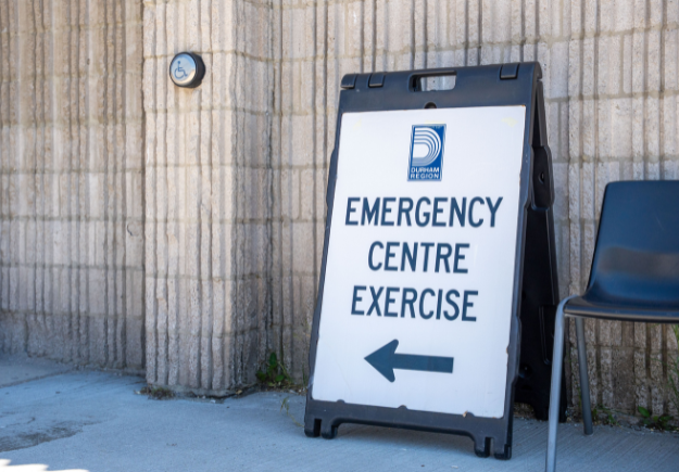 An a-line sign that reads "Emergency Centre Exercies"