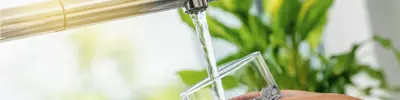Glass being filled from tap