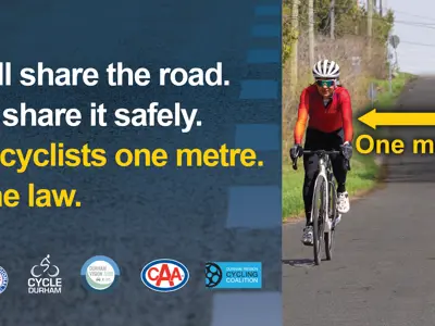 We all share the road. Let's share it safely. Give cyclists one metre. It's the law. Various local road safety partner logos. A person cycling
