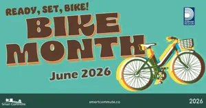 Teal promotional graphic with bold text reading “Ready, Set, Bike! Bike Month June 2026.” A colorful illustrated bicycle appears on the right, with Durham Region and Smart Commute logos displayed.