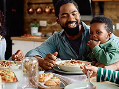 Young family at the dinner table