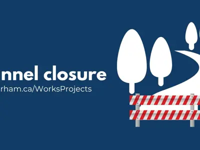 Graphic promoting a tunnel closure. White text on a dark blue background reads “Tunnel closure” and “durham.ca/WorksProjects.” An illustration of a pathway blocked by a red-and-white construction barricade appears beside several stylized trees.